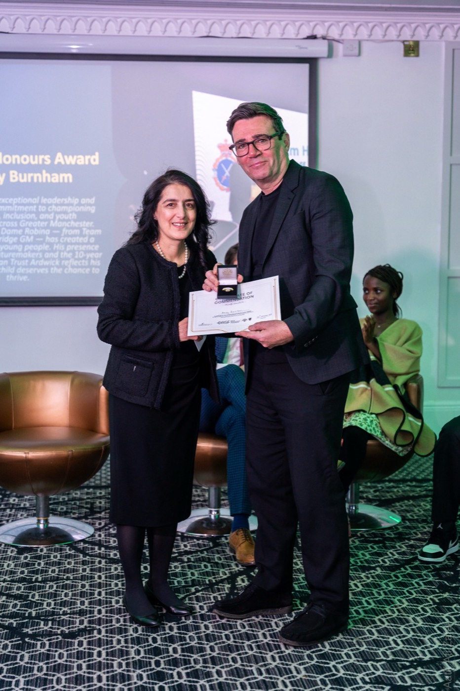 An award presentation at the DRSF launch event
